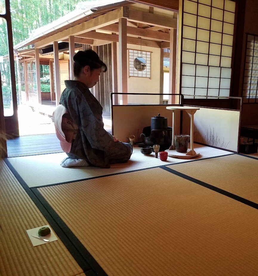 Japanese woman conducting tea ceremony