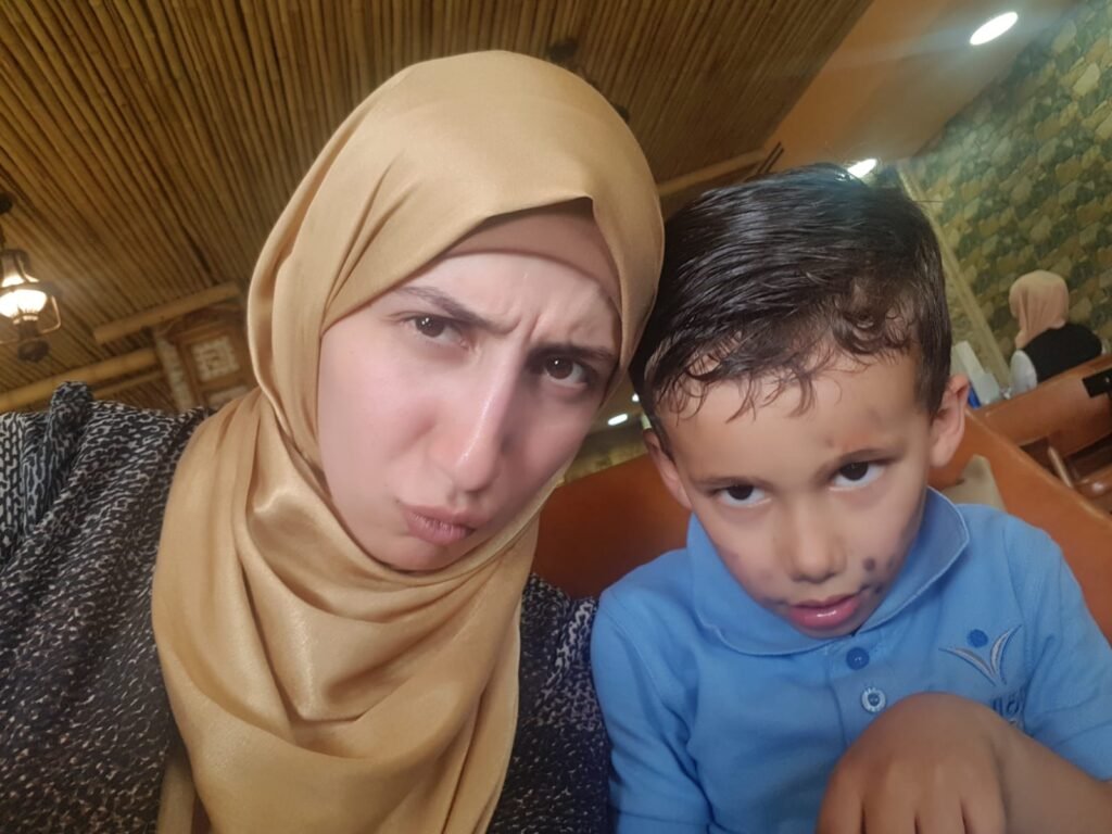 Wiam Najjar selfie shot with a young boy