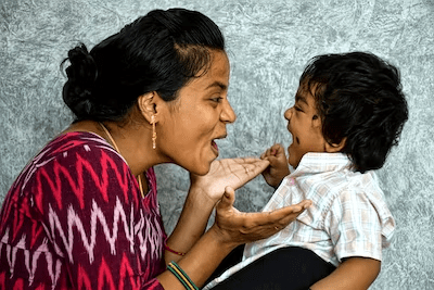 Mother and child smiling at each other