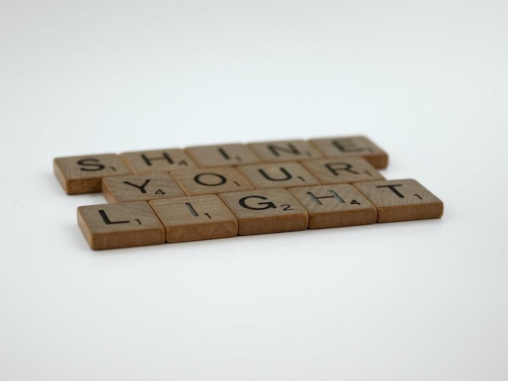 Scrabble letter squares next to each other