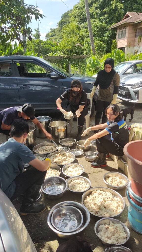 PawsUp staff members preparing food for the animals