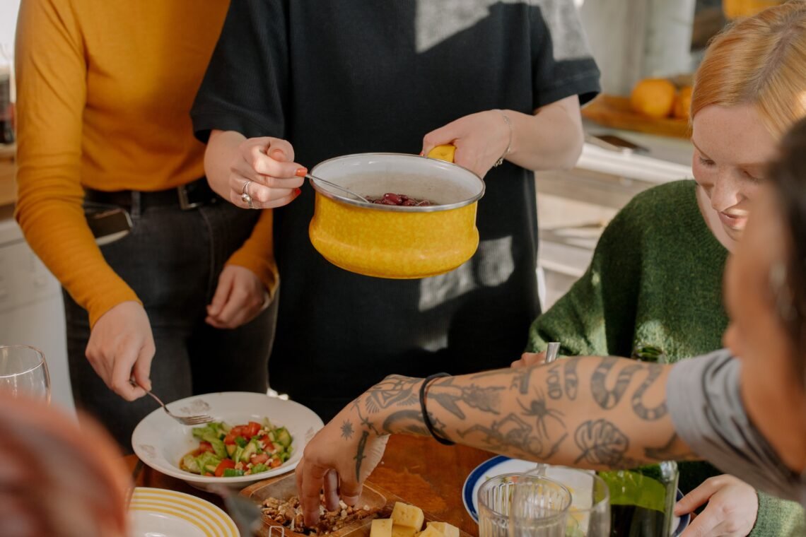 Family cooking and sharing dishes