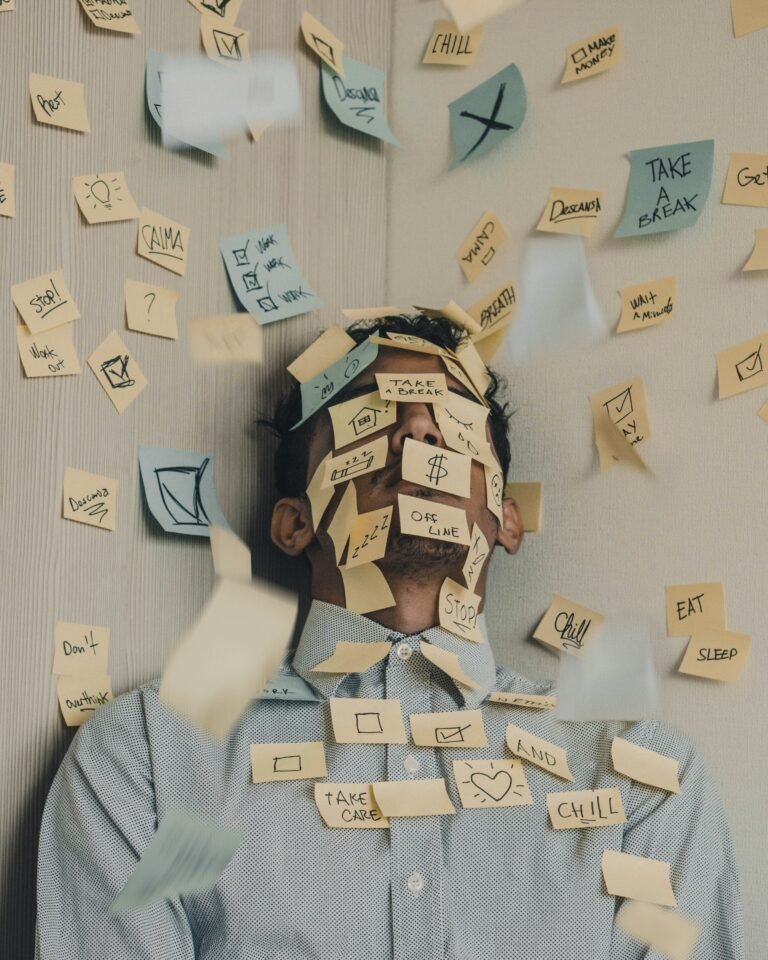 A person's face covered with post it notes
