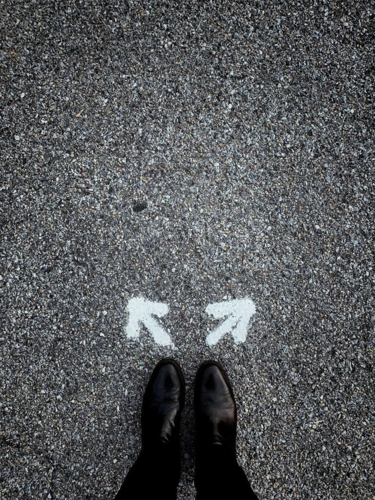 footsteps standing on pavement with two arrows; one pointing left and the other pointing right