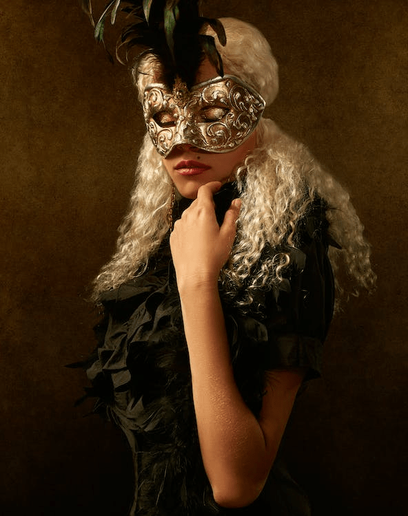 a portrait of a woman with a mask over her face